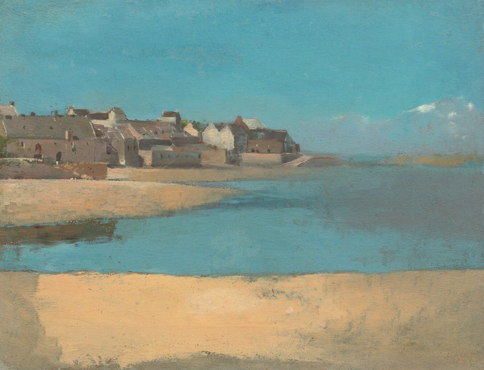 Coastal town with buildings on a hill overlooking water